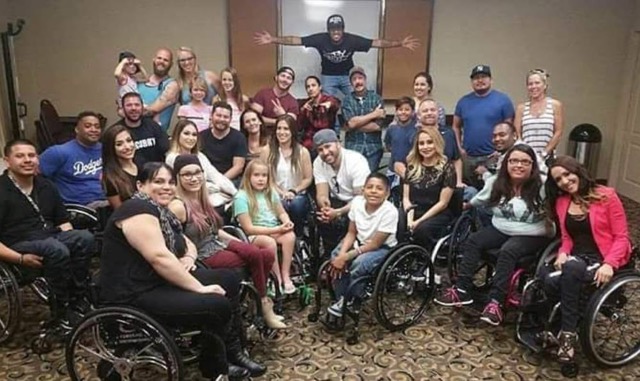 Group photo of the cast of Minority Effect. Most of the cast use wheelchairs and are center in the photo with the rest of the cast standing behind them.