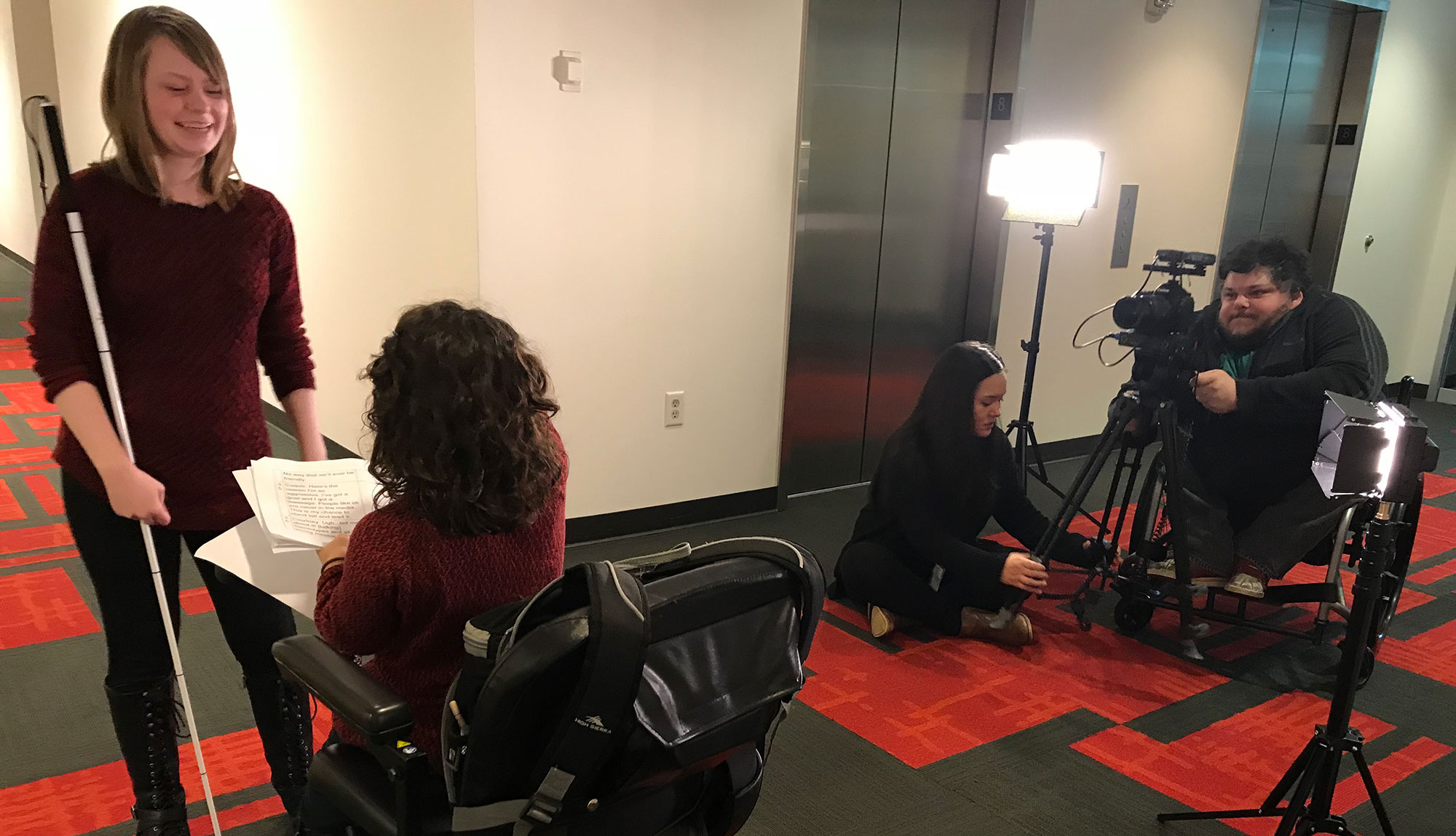 Film crew prepares for a scene in a hotel hallway